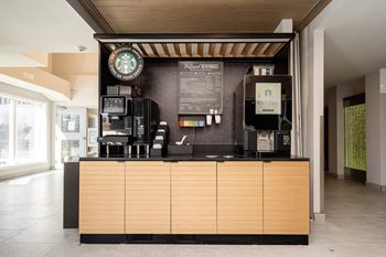 the coffee counter in the lobby of a starbucks store